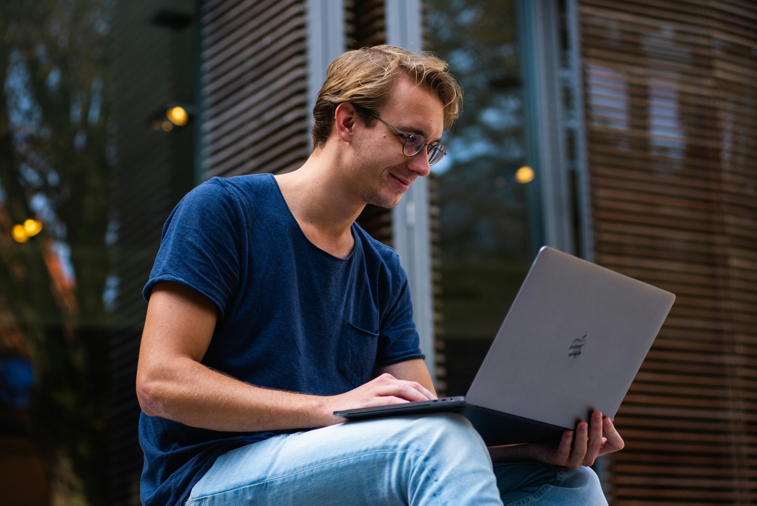 Man using laptop outside setting a complex password