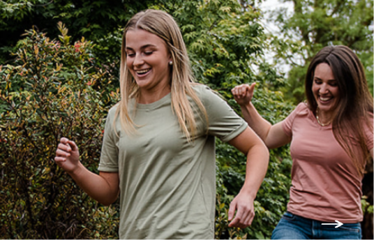 Two women walking happily